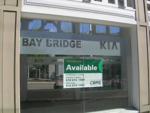 kia City officials are working to attract new businesses to empty Broadway storefronts, like this one at Bay Bridge Kia.