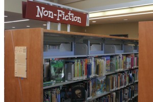 20110126_LIBRARY_hautala3 Stacks of non-fiction books are marked with a kid-friendly font in the 81st Avenue Library. Neighborhood kids and students will also have access to children's librarian Derrick DeMay.