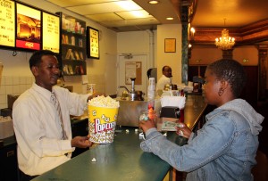 College student Imani Sutton stocked up on popcorn and candy before the premier of "Yelling to The Sky" on Thursday night. College student Imani Sutton stocked up on popcorn and candy before the premier of "Yelling to The Sky" on Thursday night.