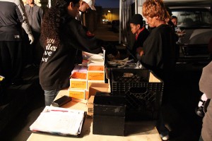IMG_9424 Emily Renteria and WIllie Dudley hand out sterile syringes, supplies, and hot food at a recent HEPPAC exchange.