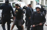 OPD officers arrest a protester during the Occupy Oakland encampment eviction on October 25, 2011. Oakland officials may have to respond to criticisms of the OPD's actions during the Occupy Oakland protests at the next NSA meeting to discuss progress in the 12 years since the Riders settlement. Photo by Brittany Schell.