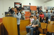 Oakland Tech history teacher Tania Kappner addresses the board on Wednesday morning, with TV cameras behind her.