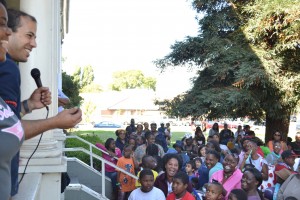 20120826_Husain_WHATNOWAMERICA6 Milad Yazdanpanah and Aaronisha Austin smile at the crowd while reading out numbers for the raffle giveaway.