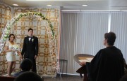 Myrna Flores performs marriage ceremony for Carlos and Paola, one of the couple who married at the Alameda County Clerk-Recorder’s office last Friday.