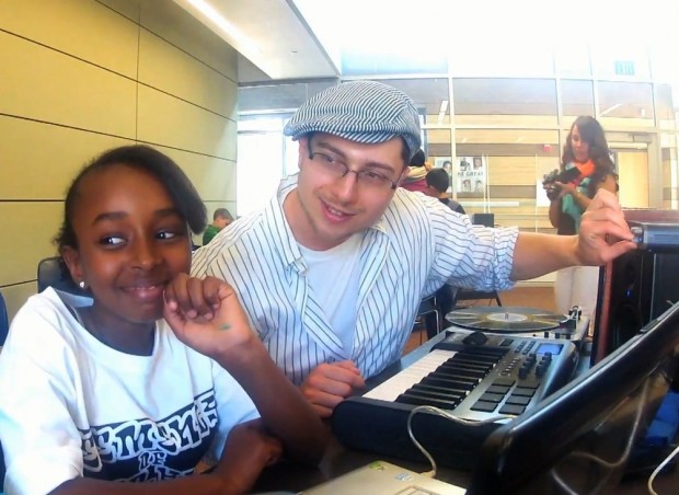 Dr. Elliot Gann and a student work on beat making at a workshop in San Jose. Photo by Carlos De Leon.
