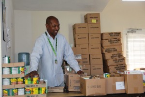 Man sorts canned goods.