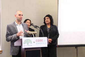 Code for America fellow and RecordTrac designer Cris Cristina talks about the program while Mayor Jean Quan and City Administrator Deanna Santana look on. Photo by Becca Andrews.