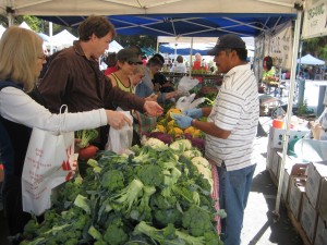 Vendor Sam Lunes says the customers keep coming but that they're spending less