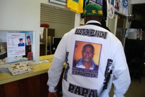 A customer orders a memorial T-Shirt at All In One Stop, Miller's San Leandro print shop.