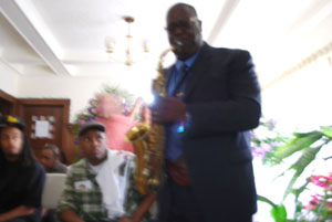 davis_sax2 Saxophonist Jesse Davis, the father of Desiree Davis, plays a tribute to his daughter on Monday following her memorial service.
