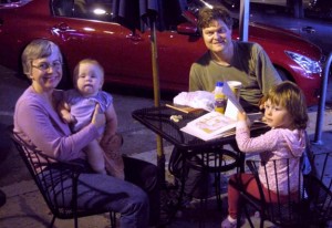 Francis Upton and Martha Lyman outside Café DiBartolo with one-year-old Ona and three-year-old Leah. 