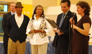 Phyllis and Tony Hall listen as Jody London thanks them for their decade of service.