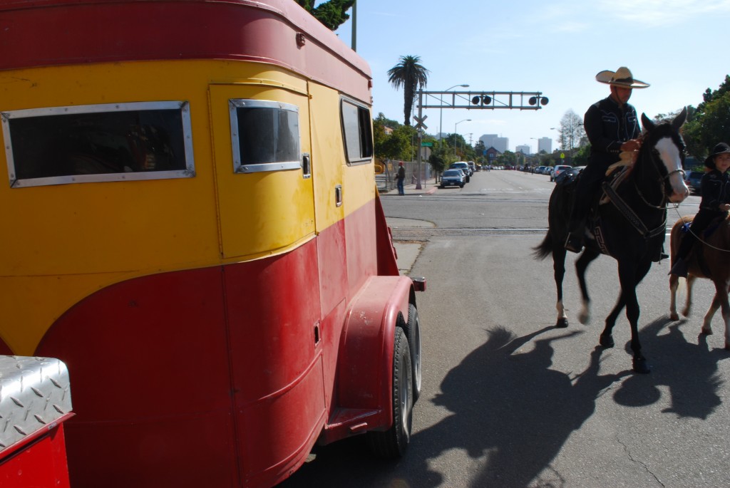 charro_parade A man dressed in the traditional Mexican cowboy style prepares his horse for a ride with his son in Saturday's parade. The event honored the multicultural roots of America's cowboy traditions.