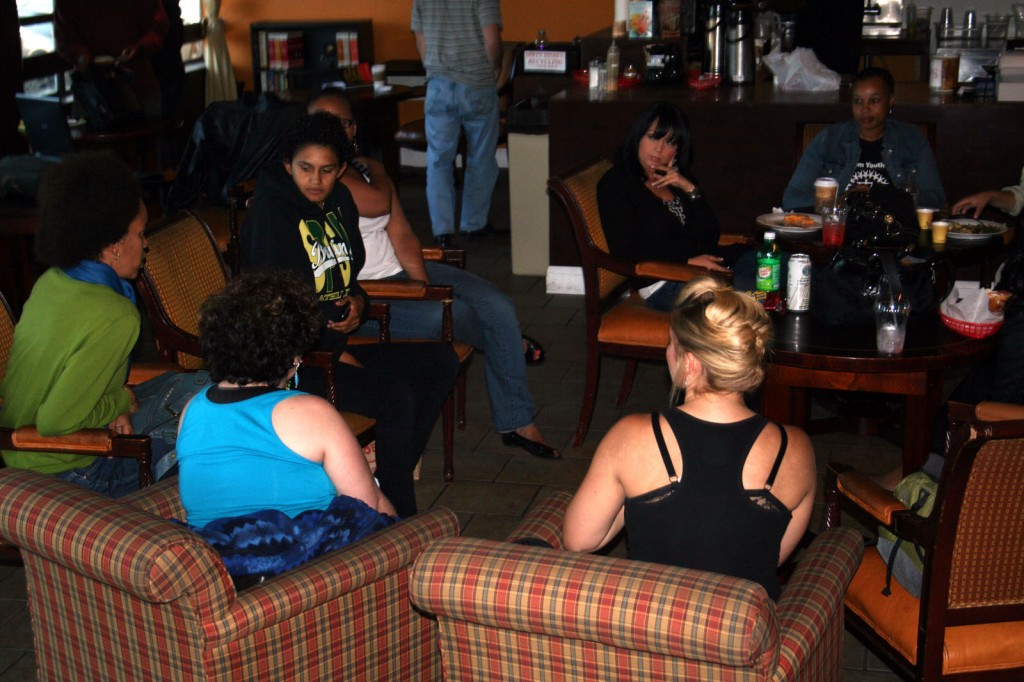 people sitting in chairs at Grand Lake Coffee House
