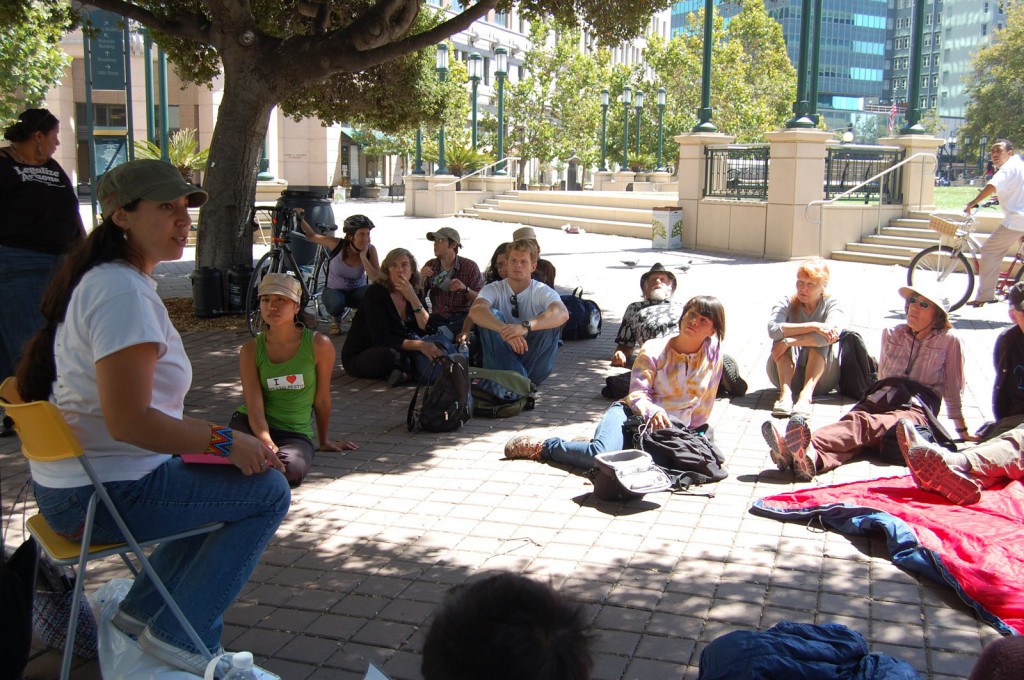 Carla Perez, program coordinator with Movement Generation, teaches a workshop on how to respond to a natural disaster in Sunday in Downtown Oakland. Photo by Terria Smith.