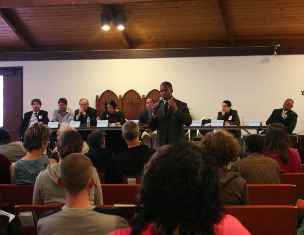 Young speaks at a mayoral forum at Faith Presbyterian Church about his leadership experiences and plans to improve youth recreational facilities. "These young people need help and 4 percent towards your recreational facilities isn't enough."