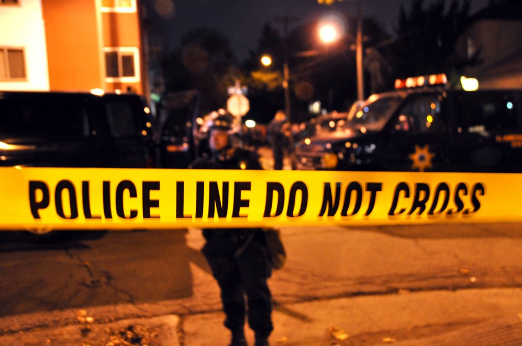 Police cordon off a residential block Friday night in East Oakland, where protesters were arrested following the announcement of the Johannes Mehserle sentencing. Photo by Nicole Jones.