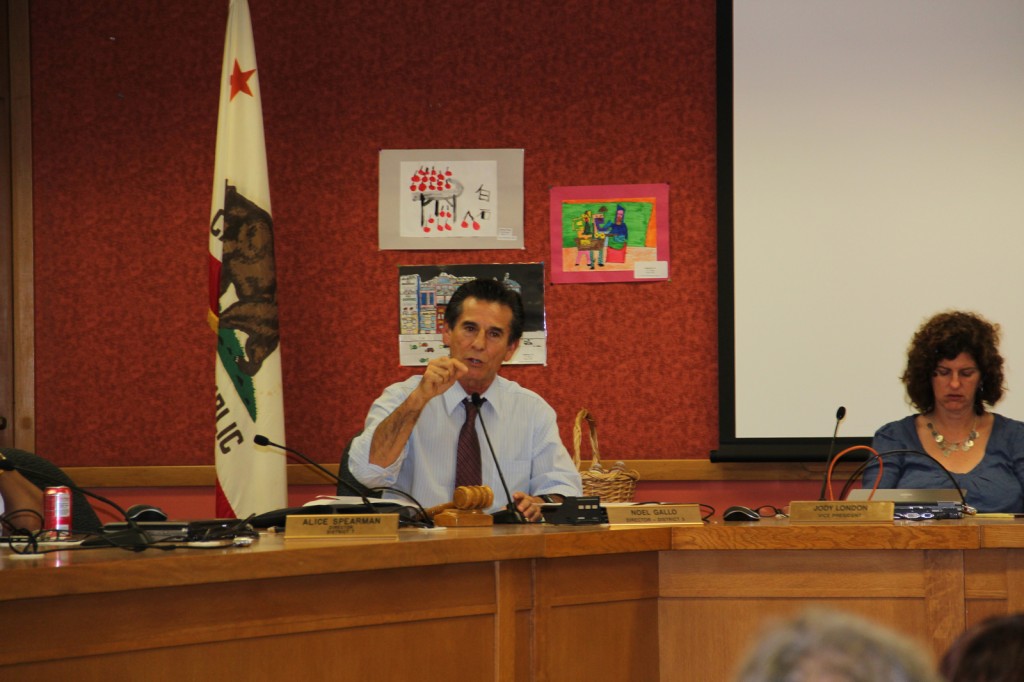 OUSD board member Noel Gallo addresses protesting parents, faculty, and staff from Kaiser Elementary School during a facilities board meeting Tuesday.