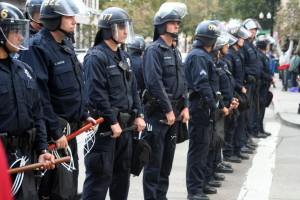 20111025_schell_police Police officers in riot gear line the intersection at Broadway and 14th Street, across from Frank H. Ogawa plaza. Photo by Brittany Schell.