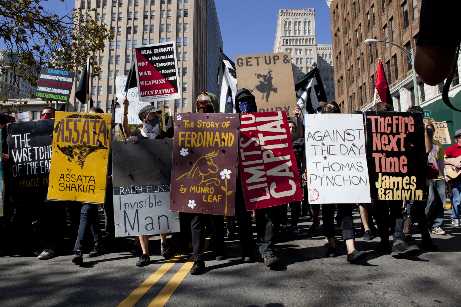 Occupy Oakland protesters march through downtown streets, tent city