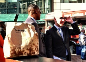 Staff watch over Councilmember-at-large Rebecca Kaplan's lunch, which she purchased at the Doc's of the Bay food truck before the press conference.