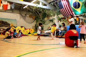 CAPOEIRA_kinder_warriors_1 Instructor Yania Escobar (standing, far right) guides her preschool capoeristas through a sparing match.