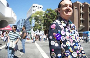 Ken Prag, of San Francisco, shows off his buttons in support of gay marriage at Sunday's Pride festival.