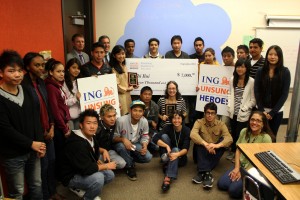 ING executives, school staff and students in Thi Bui's 11th grade computer class smile for the camera after the check presentation.