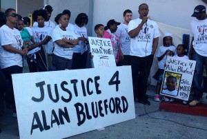 Adam Blueford, father of Alan Blueford, addresses the crowd of about 50 supporters outside the Eastmont substation for the Oakland Police Department.