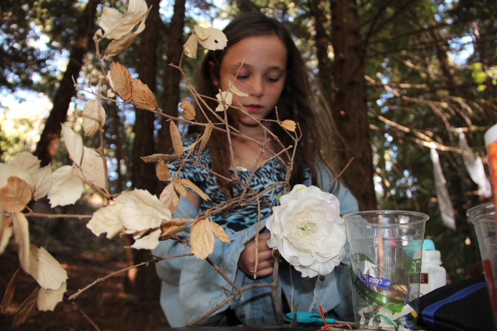 Franciesca Adams, 9, creates a "fantasy tree" at the Art in Nature festival.
