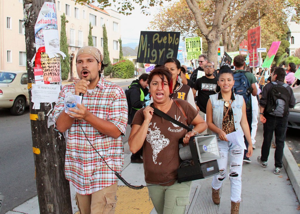 Pablo Paredes, organizer of 67 Sueños, leads protest against Mi Pueblo Food Center in Oakland