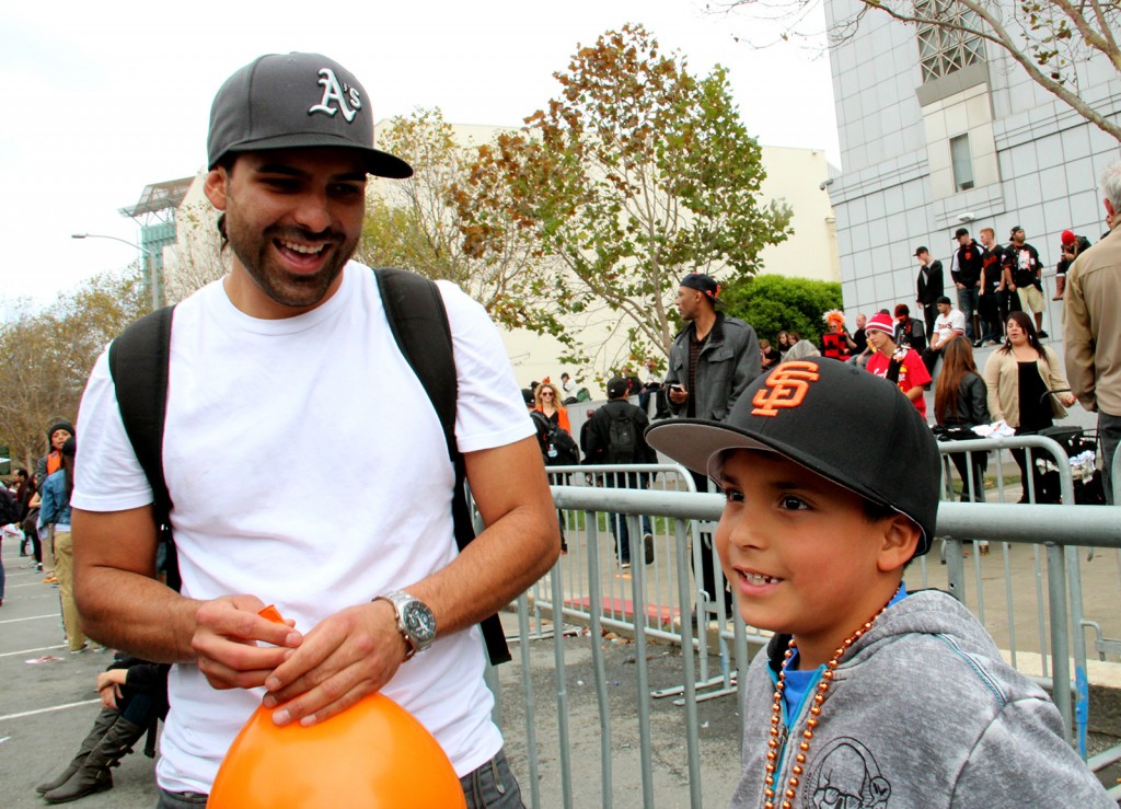 Zack (left) and his son Julien Etnyre have split baseball loyalties, but little animosity when it comes to the Giants victory. Photo by Mihir Zaveri.