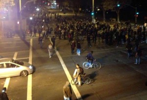 Protesters at Grand Avenue and Harrison Street pause at the intersection. Photo by Sam Rolens.