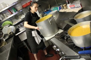 Susan Pak prepares vats full of butternut squash soup, a side dish in the Thanksgiving special meal at The Breakroom Cafe.