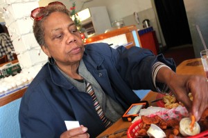 Andrea Turner samples vegan southern fried tofu and chips and dip at Souley Vegan in downtown Oakland.