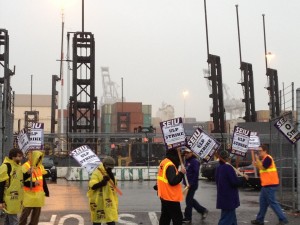 SEIU Local 1021 pickets at the entrances to the Port of Oakland container terminals, preventing truck drivers and longshoremen from entering the Port.