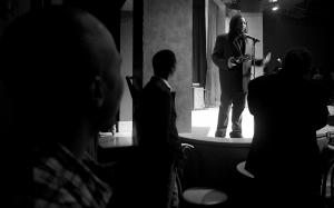 Black Media Appreciation Night organizer, journalist and long time friend of Kevin Weston, JR Valrey looks on as Weston holds back tears while thanking the audience for their support.