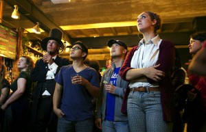 The crowd watches Mitt Romney's concession speech at The Make Westing bar in downtown Oakland.