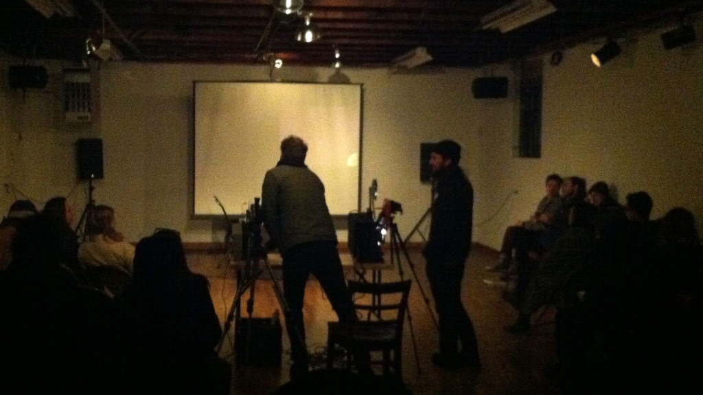 John David and Josh Churchchill prepare for the performance at Shapeshifters Cinema Sunday night.
