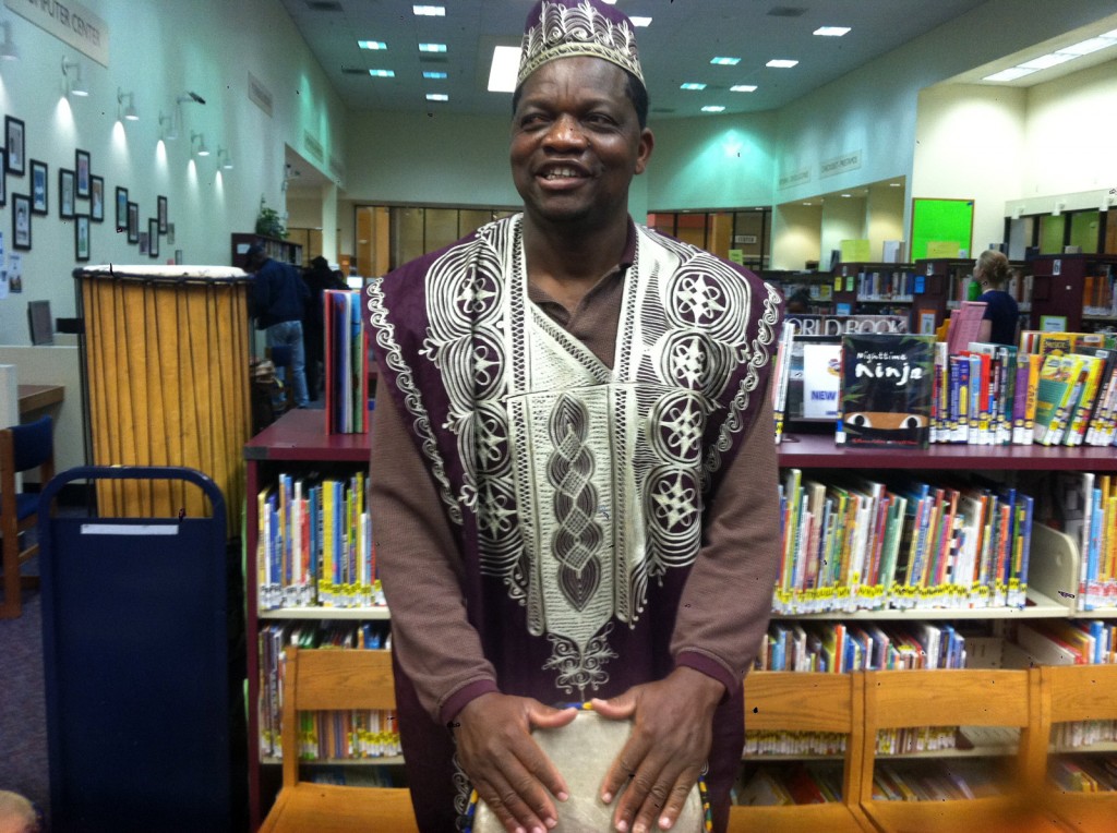 Drummer Ben Ofori spends time at Eastmont Library teaching children about West African music.