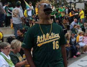 A's fan wearing a horse mask.