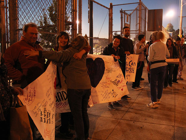 Attendees hugged and marched in support of Luke "Sasha" Fleischman, 18, who was badly burned by another teenager on his bus ride home. Photo by Becca Andrews.