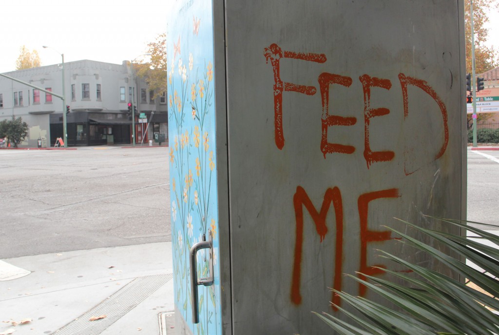 Graffiti says "feed me"