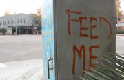 Graffiti says "feed me"