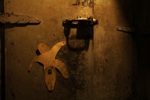 An old banana sticker on a storage room door.