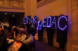 Concerned citizens lined the back wall of the council chambers at City Hall to protest the Domain Awareness Center. Photo by Becca Andrews.
