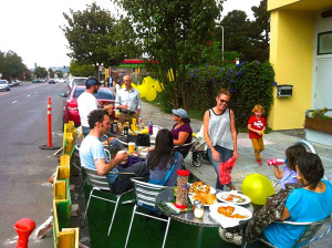 Dan Kalb (back), a big supporter of the LCA and their greening efforts in the neighborhood, came to join the fun at the parklet outside MLK Cafe in 2013. Photo courtesy of Yuri Jewett