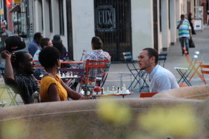 People sitting in Latham Park Pilot Plaza