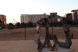 Image of the sculpture and vacant lot.