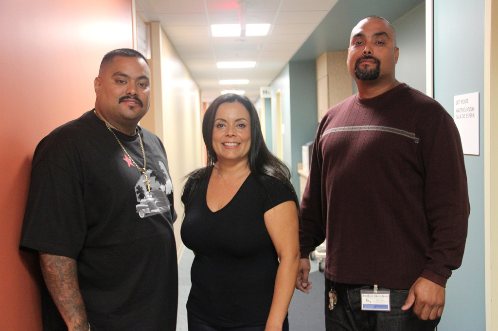 Project New Start staff members Javier Jimenez, Cindy Santiago and Julian Jimenez at the San Leandro tattoo removal clinic
